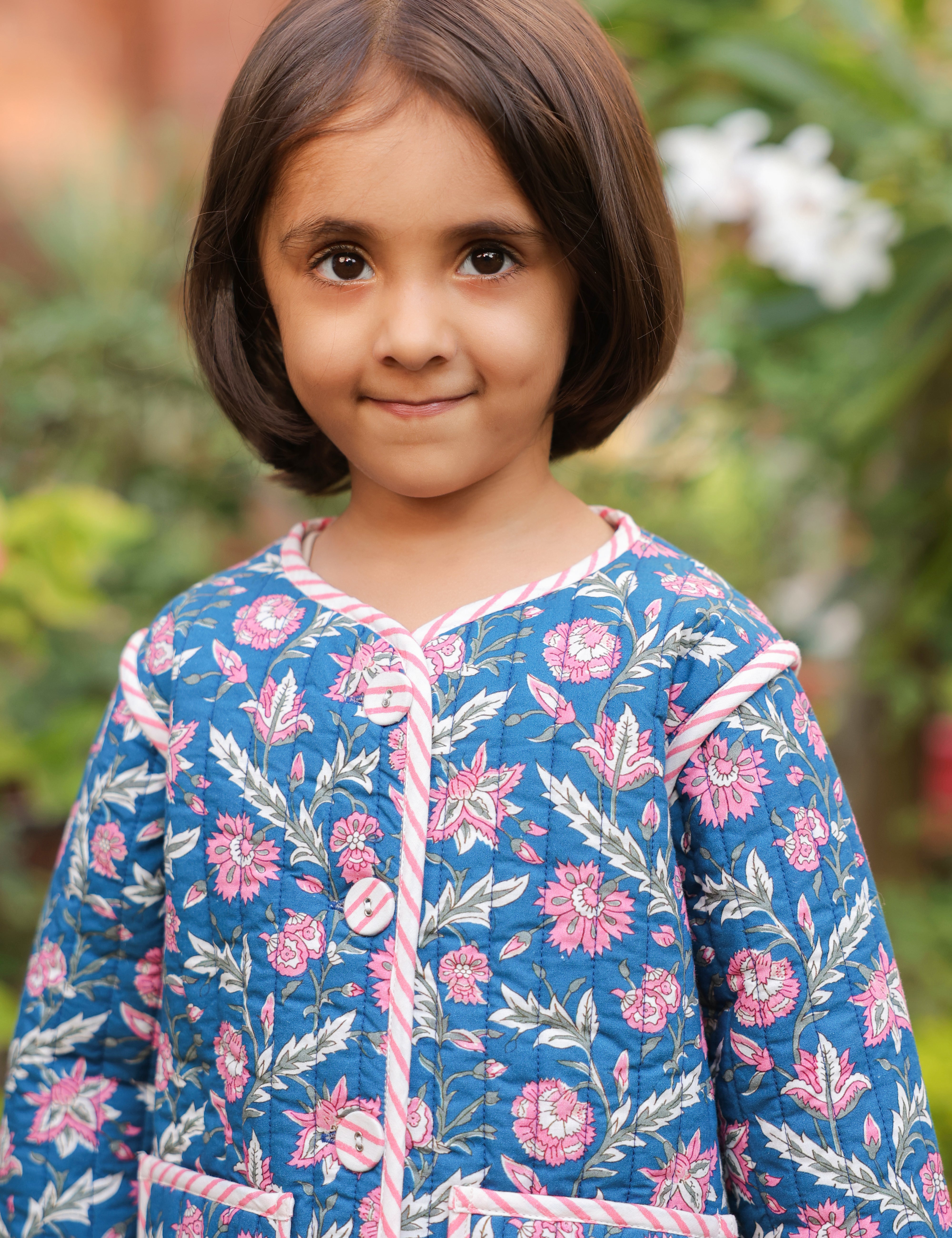 Girl wearing floral quilted cotton jacket with jeans