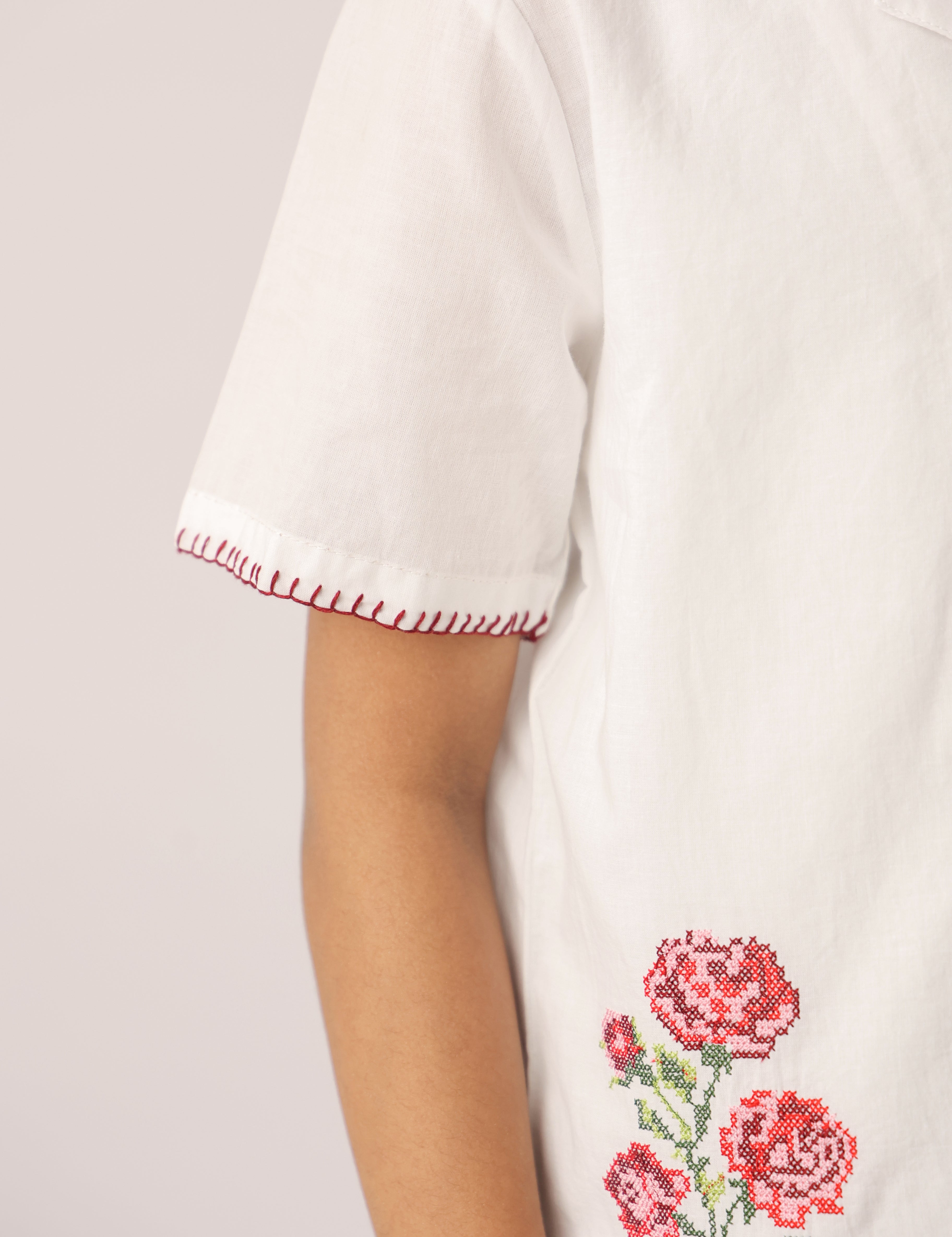 white shirt with embroidered flowers