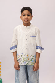 white shirt with embroidered flowers